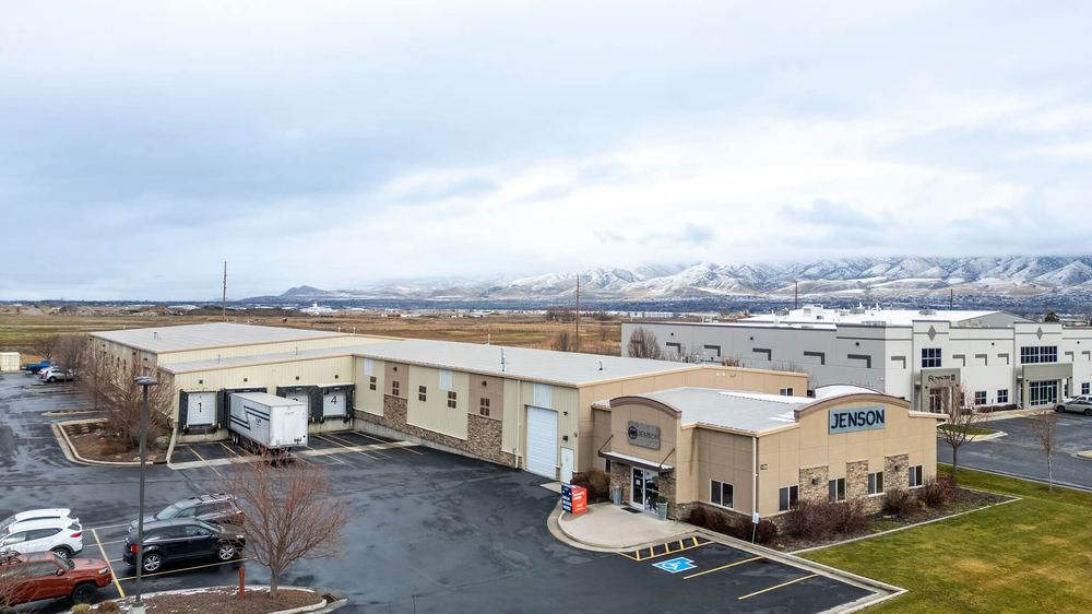 Aerial view of the Jenson Indoor Storage building with the Cache Valley mountains in the background