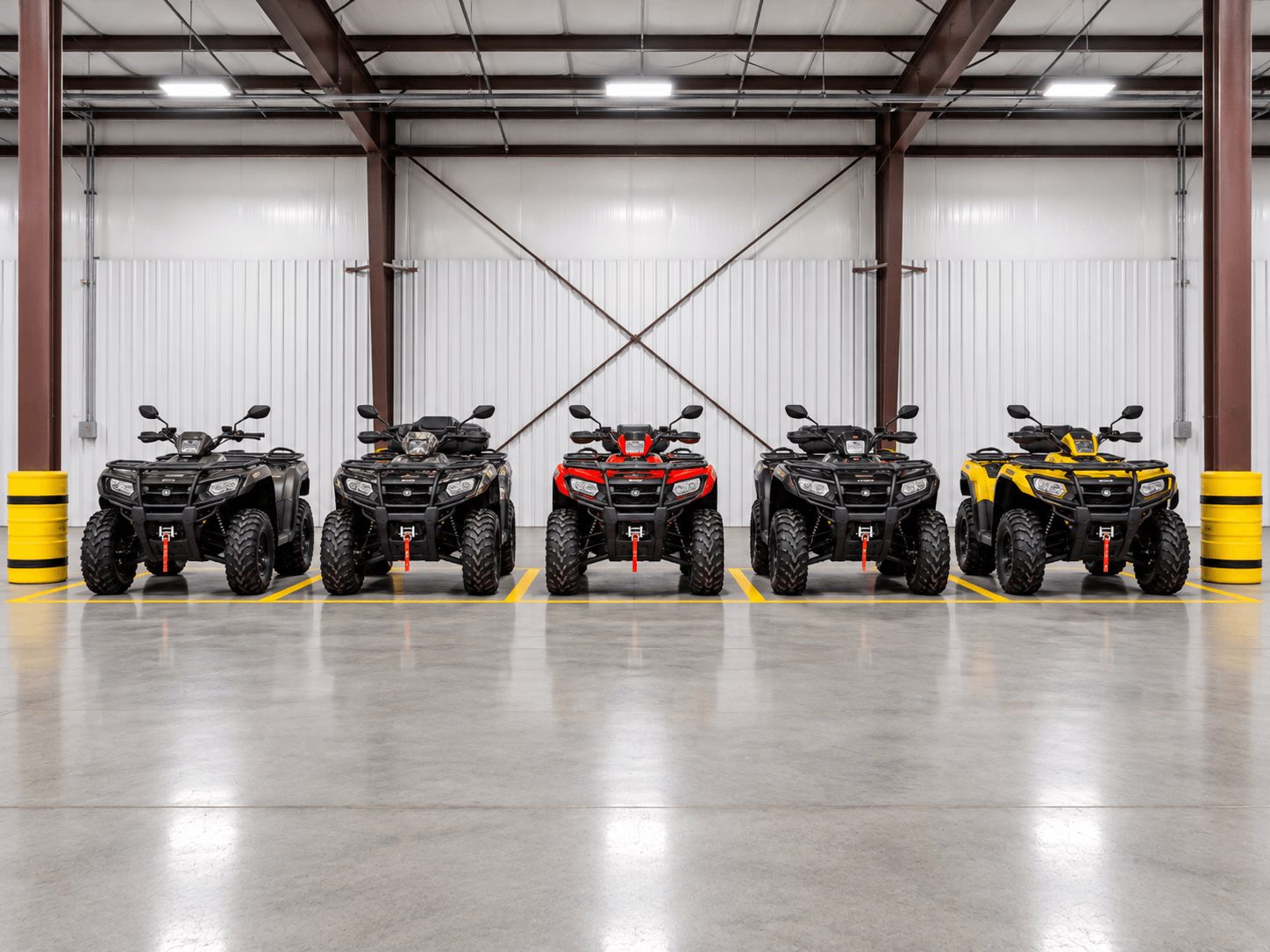 A row of ATVs parked inside the heated Jenson Storage building in Logan, Utah